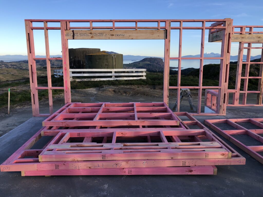 Pre-nailed timber wall frames on site for the Alpine High Performance Home, overlooking Lake Taupō