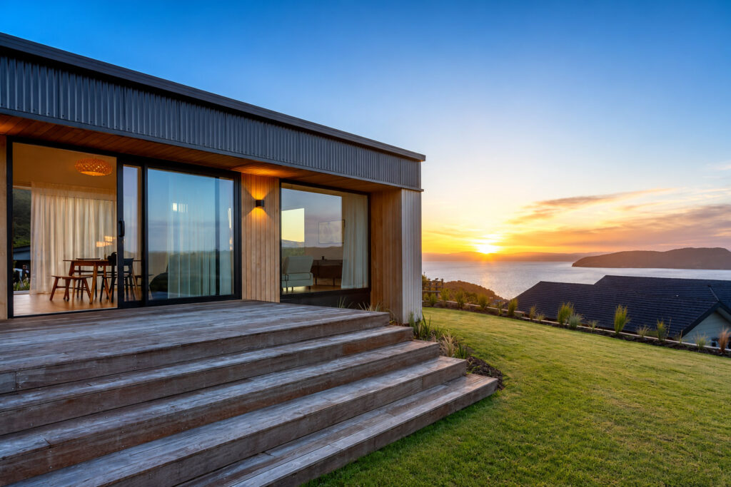 Sunset over Lake Taupō from the deck of a High Performance Home