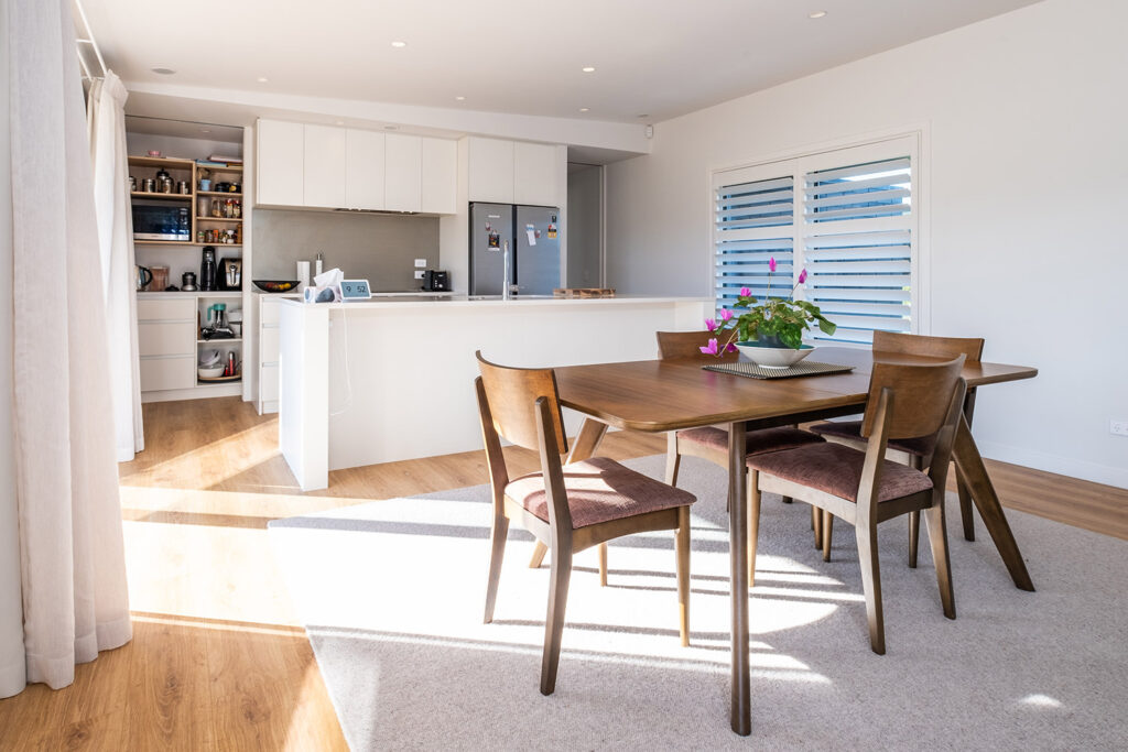 Bright open-plan kitchen and dining area in a High Performance Home
